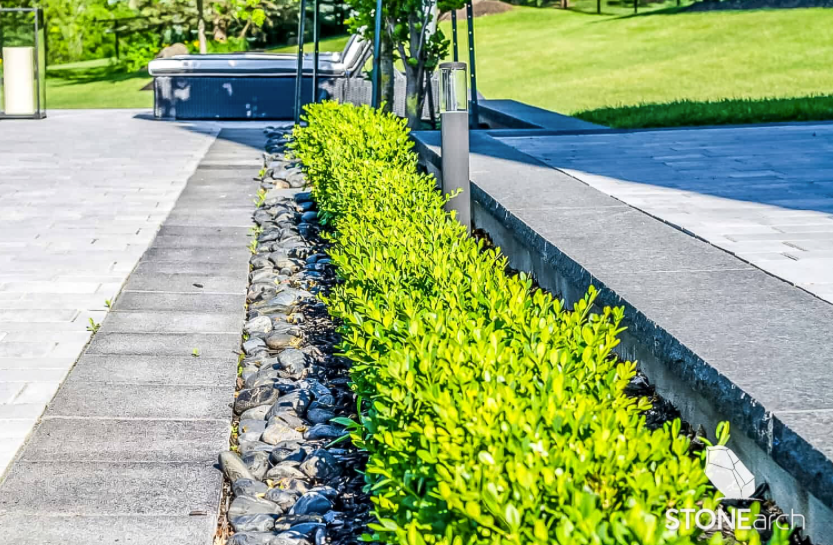 Pebbles - Black Granite/Basalt - Polished - 2-3" (1 Ton Bag)